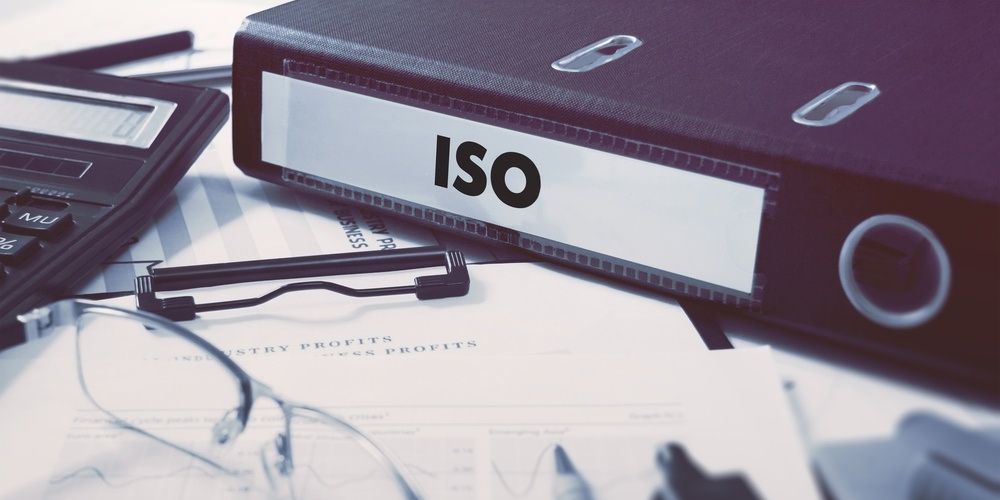 On the Office Desktop with Office Supplies is an office folder with the inscription ISO - International Organization for Standardization.