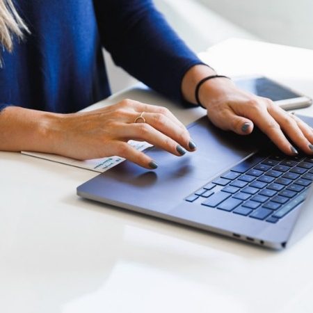As an Example of Technical Writing, a Woman Typing on Her Laptop
